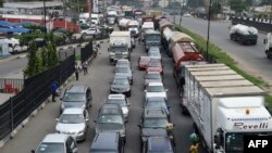 FILE - Motorists queue in a traffic gridlock in Lagos, on May 4, 2020.