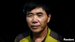 FILE - North Korean defector Lee Min-bok poses for photographs during an interview with Reuters at his home in Pocheon, about 15 km (9 miles) south of the demilitarized zone separating the two Koreas.