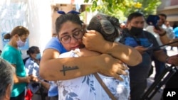 People react outside the court after Argentine Bishop Gustavo Zanchetta was convicted and sentenced to 4 1/2 years in prison for continued sexual abuse of two former seminarians in Oran, Argentina, March 4, 2022. 