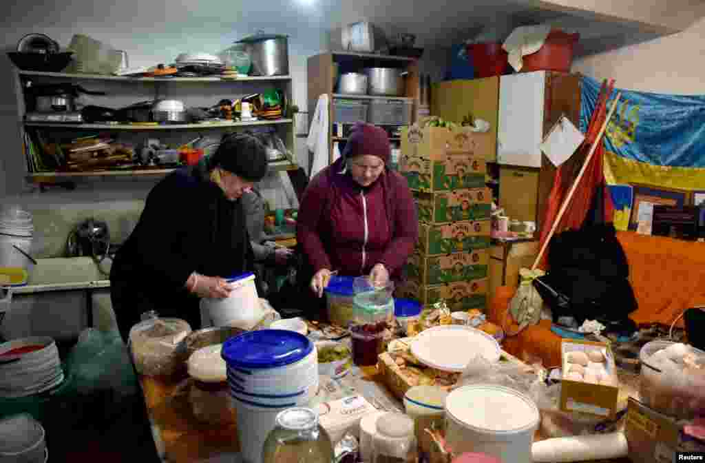 People from the Lviv Volunteer Kitchen prepare food and dry rations for the Ukrainian military on the front lines, in Lviv, March 9, 2022.