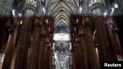 FILE - An empty Duomo is seen during the coronavirus outbreak, in Milan, Italy, March 5, 2020. 