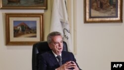 FILE - Lebanon's Central Bank Governor Riad Salameh gives an interview with AFP at his office in the capital Beirut, Dec. 20, 2021.