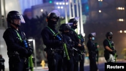 Police officers stand guard outside of Staples Center during Election Day in Los Angeles, California, U.S., November 3, 2020.