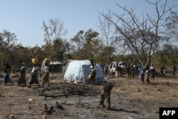 FILE - Burkina Faso refugees are seen at a shelter in Tougbo on Jan. 22, 2022. Thousands of people who fled to Ivory Coast from jihadist attacks in Burkina Faso are living in limbo.