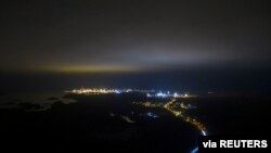 FILE - An aerial view shows the Olkiluoto nuclear power plant area in Eurajoki, Finland, Dec. 10, 2020.
