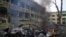 A car burns at the site of a maternity hospital damaged by shelling in Mariupol, Ukraine, March 9, 2022.