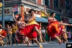 Some of the stars from "West Side Story," from left, Ilda Mason as Luz, Ariana DeBose as Anita, and Ana Isabelle as Rosalia perform in this image from 20th Century Studios. The movie is nominated for several Oscars, including Best Picture.