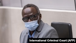 This handout photo shows former senior commander of the Sudanese Janjaweed militia Ali Muhammad Ali Abd-Al-Rahman during a confirmation hearing over alleged war crimes and crimes against humanity committed during the Darfur conflict in 2003-04, in The Hague, May 24, 2021.