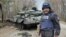 Ukrainian journalist Andriy Tsaplienko covers clashes between Ukrainian and Russian forces about 93 miles (150 kilometers) northwest of the capital Kyiv, March 23, 2022. (Courtesy photo)
