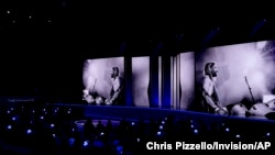 The late Taylor Hawkins, the Foo Fighters drummer, appears on screen during an In Memoriam tribute at the 64th Annual Grammy Awards on Sunday, April 3, 2022, in Las Vegas. (AP Photo/Chris Pizzello)