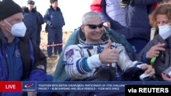 The International Space Station (ISS) crew member NASA astronaut Mark Vande Hei rests after landing with the Soyuz MS-19 space capsule in a remote area outside Zhezkazgan, Kazakhstan March 30, 2022, in this still image taken from video. 