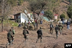 Indian army soldiers conduct a search operation after gunmen opened fire in the remote village of Dangri in Rajouri district, Jan. 2, 2023.
