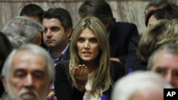 FILE - Greek lawmaker Eva Kaili, center, in Athens, Nov. 3, 2011.