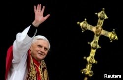 FILE - Pope Benedict XVI, Cardinal Joseph Ratzinger of Germany, waves from a balcony of St. Peter's Basilica in the Vatican after being elected by the conclave of cardinals, April 19, 2005.