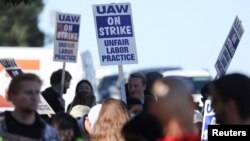 FILE - Academic workers at the University of California-San Diego walk out as thousands of employees at the UC campuses strike to secure improved pay and working conditions, in San Diego, Nov. 14, 2022.