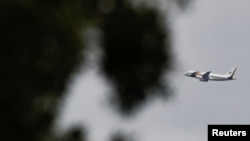 The plane of Brazilian President Jair Bolsonaro flies near Alvorada Palace in Brasilia, Brazil, Dec. 30, 2022.