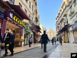 Streets around the historic site Ruins of St. Paul’s remain quiet after the easing of entry rules in Macao on Dec. 28, 2022. (AP Photo/Kanis Leung)