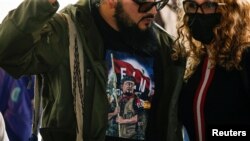 FILE - Tomas Garcia, a member of Colombia's National Liberation Army (ELN) delegation, attends a news conference after holding the last round of peace talks with Colombia's government for the year, in Caracas, Venezuela Dec. 12, 2022. 