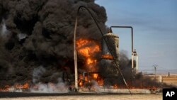 Smoke rises from an oil depot struck by the Turkish air force near Qamishli, Syria, Nov. 23, 2022. Turkey this week launched airstrikes on suspected Kurdish rebels hiding in neighboring Syria and Iraq, in retaliation for a bombing in Istanbul blamed on Kurdish groups. 