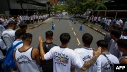 Fans of Santos attend a vigil outside the Albert Einstein Israelite Hospital where Brazilian football legend Pele is hospitalized in Sao Paulo, Brazil, on Dec. 4, 2022.