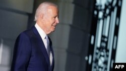 FILE - U.S. President Joe Biden walks to board Marine One on the South Lawn of the White House in Washington, Jan. 6, 2022.