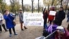 People gather outside the National Assembly in Paris, Nov. 24, 2022, as lawmakers in France's lower house of parliament began debating a proposal to enshrine abortion rights in the country's constitution. The measure later passed easily, but its future remains unclear.