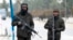 Taliban security personnel stand guard at a checkpoint along a street in Kabul on Jan. 10, 2023. 