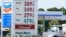 A Chevron and Shell gas station post the same prices for gasoline, Dec. 12, 2022, in Miami, Florida.