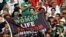 Iran fans hold a banner reading 'Woman life freedom' inside the stadium during the Group B match between England and Iran at Khalifa International Stadium, Doha, Qatar, on Nov. 21, 2022.