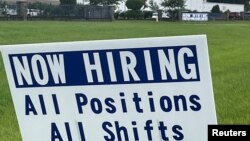 FILE - A sign advertising jobs stands near the SMART Alabama, LLC auto parts plant and Hyundai Motor Co. subsidiary, in Luverne, Alabama, July 14, 2022.