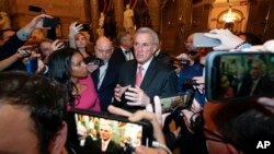 Reporters surround Rep. Kevin McCarthy as he walks out of the House chambers after the House met for the third day to elect a speaker and convene the 118th Congress in Washington, Jan. 5, 2023. 