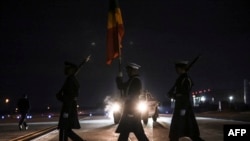 The U.S. military Honor Guard approaches a plane as an African delegation arrives at Joint Base Andrews in Maryland, Dec. 11, 2022, to attend the US-Africa Leaders Summit. 