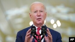 US President Joe Biden speaks in the East Room of the White House, Dec. 22, 2022, in Washington.