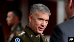 FILE - National Security Agency Director Gen. Paul Nakasone arrives for a Senate hearing in Washington, April 5, 2022. Nakasone on Jan. 12, 2023, urged Congress to renew powers granted to U.S. spy agencies to surveil communications.