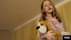 Anya with Hibuki, a therapeutic toy to help children deal with stress during the War