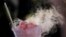 Ilustrasi - Cikbul (Ciki Ngebul/Ice Smoke) atau yang biasa disebut Dragon's Breath di AS, disajikan di karnaval State Fair Meadowlands, East Rutherford, New Jersey, Kamis, 5 Juli 2018. (AP Photo/Julio Cortez)