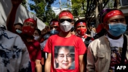 FILE - A protester wears a T-shirt of detained Myanmar civilian leader Aung San Suu Kyi during a demonstration outside the Embassy of Myanmar in Bangkok on Dec. 19, 2022. Lawyers for Suu Kyi have not been allowed to see her as they prepare appeals, unnamed legal officials said.