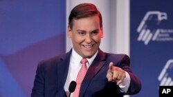 FILE - Rep.-elect George Santos speaks at an annual leadership meeting of the Republican Jewish Coalition, Nov. 19, 2022, in Las Vegas. Santos, who won a seat in Congress in November, is under pressure to explain himself amid evidence that he fabricated parts of his life story. 