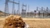FILE - A farmer naps in a barley field next to an electricity power plant near a village in Mekelle, Tigray, Oct. 25, 2013. Ethiopia's electric company says it has reconnected the capital city to the national grid. 