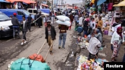 A laborer pushes a handcart at the Mercato open-air marketplace in the district of Addis Ababa, July 21, 2022. (Tiksa Negeri/Reuters)