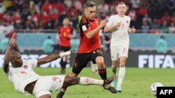 Belgium's Leandro Trossard, center, fights for the ball with Canada's Kamal Miller during their World Cup match at Ahmad Bin Ali Stadium in Al-Rayyan, west of Doha, Qatar, on Nov. 23, 2022.