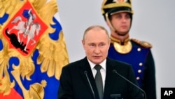 Russian President Vladimir Putin speaks during the State Prize awards ceremony while marking Russia Day in Kremlin in Moscow, Russia, June 12, 2022.