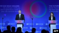 OECD Chief Economist Laurence Boone, right, and Secretary-General Mathias Cormann give a press conference to present the OECD Economic outlook at the OECD headquarters in Paris, France, June 8, 2022.