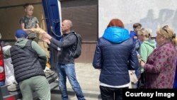 This photo, provided by the World Food Program, shows food being distributed to people in Kharkiv during the conflict in Ukraine. (Image Credit: WFP/Paul Anthem)