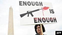 A gun control advocate participates in the "March for Our Lives" rally against gun violence, near the Washington Monument on the National Mall in Washington, June 11, 2022.