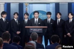 FILE - Kim Namjoon of the K-Pop band BTS and fellow members, (not in order), Kim Taehyung, Kim Seokjin, Jeon Jeongguk, Park Jimin, Jung Hoseok and Min Yoon-gi make statements against anti-Asian hate crimes at the White House in Washington, U.S., May 31, 2022. (REUTERS/Leah Millis)