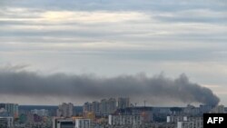 FILE - This photograph taken on June 5, 2022 shows smoke after several explosions hit the Ukrainian capital Kyiv early morning.
