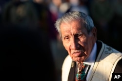 WWII veteran Charles Shay, 97 pays tribute to soldiers at dawn at the shore of Omaha Beach in Saint-Laurent-sur-Mer, Normandy, France, Monday, June 6, 2022, the day of 78th anniversary of the assault that helped bring an end to World War II.