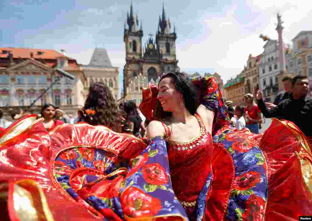 Participants of the Khamoro World Roma Festival dance through the historical center of Prague, Czech Republic.