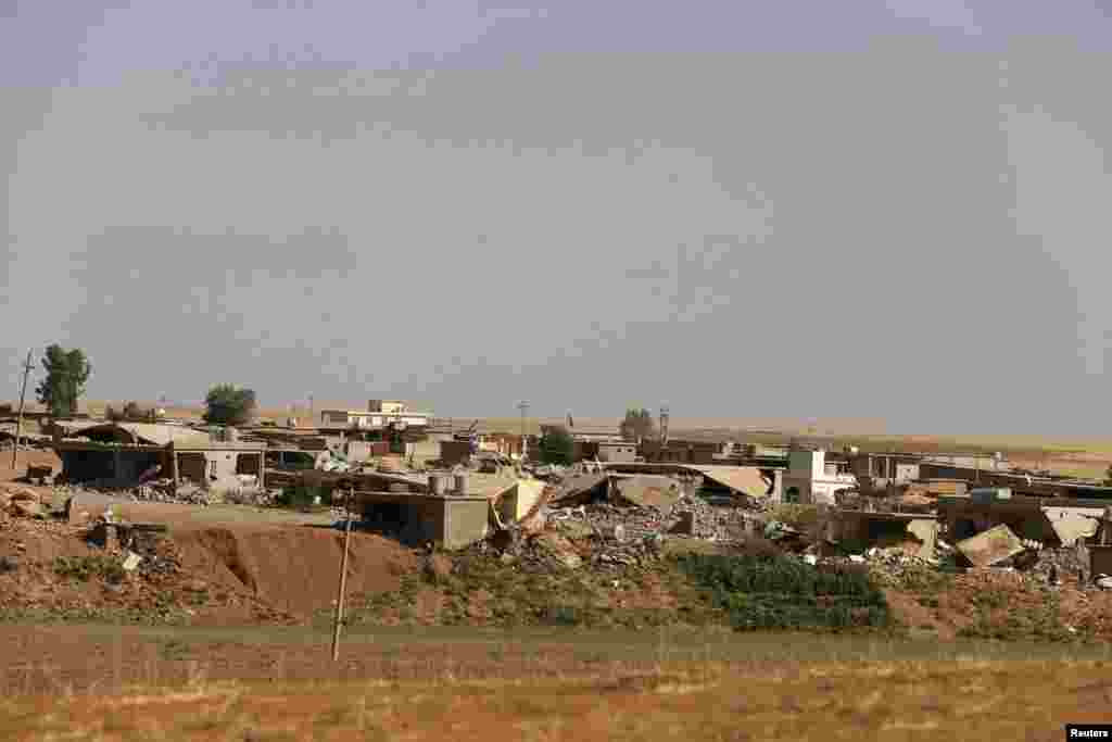 Destroyed houses near Mosul Dam, Aug.21, 2014.